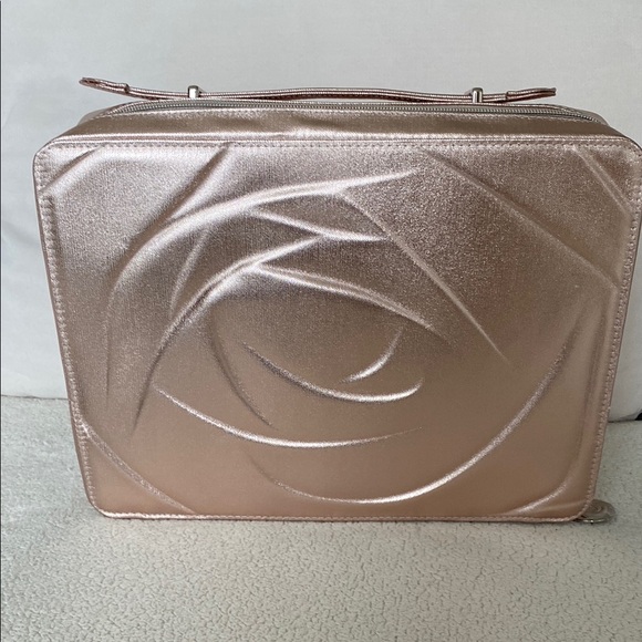 Lancome Handbags - New Lancome light pink cosmetic bag. Case with Embossed Floral Design